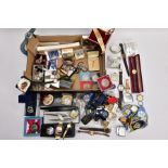 A BOX OF MISCELLANEOUS ITEMS, to include a silver gilt pin badge in the form of a dog, hallmarked