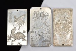THREE WHITE METAL ORIENTAL PLAQUE PENDANTS, each tested as zinc, each depicting different scenes