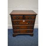 A SMALL OAK REPRODUCTION GEORGIAN STYLE CHEST OF TWO SHORT OVER THREE LONG DRAWERS, with brass