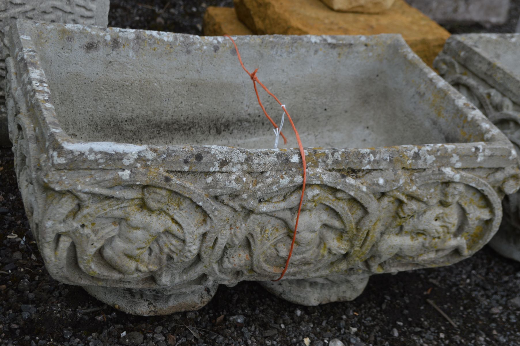 A PAIR OF COMPOSITE RECTANGULAR PLANTERS, with foliate and putto decoration, width 56cm x depth 35cm - Image 2 of 2