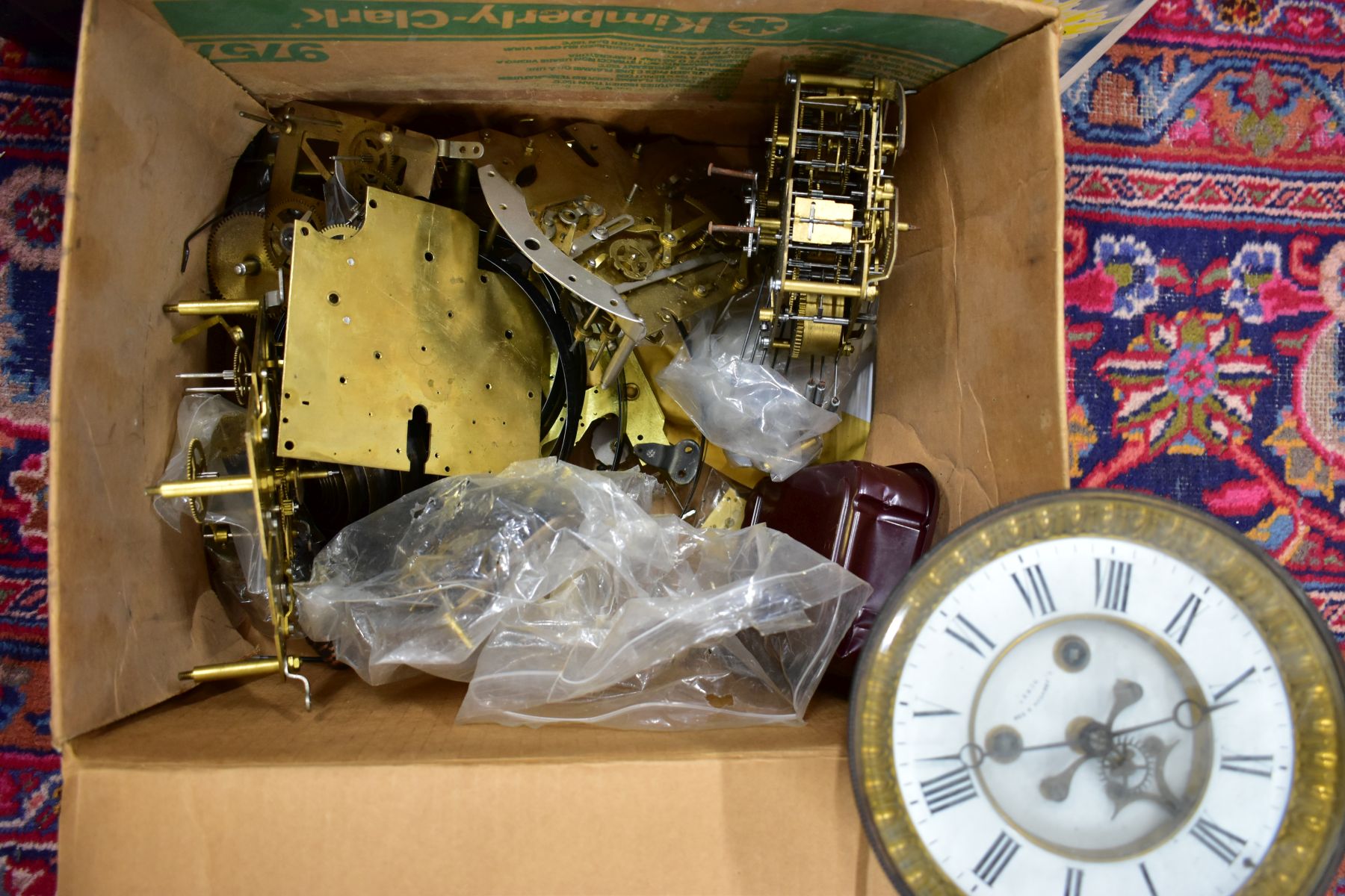 THREE BOXES OF ASSORTED WATCHMAKERS CLOCK PARTS, to include names such as 'E Johnson & Sons, Derby', - Image 2 of 4