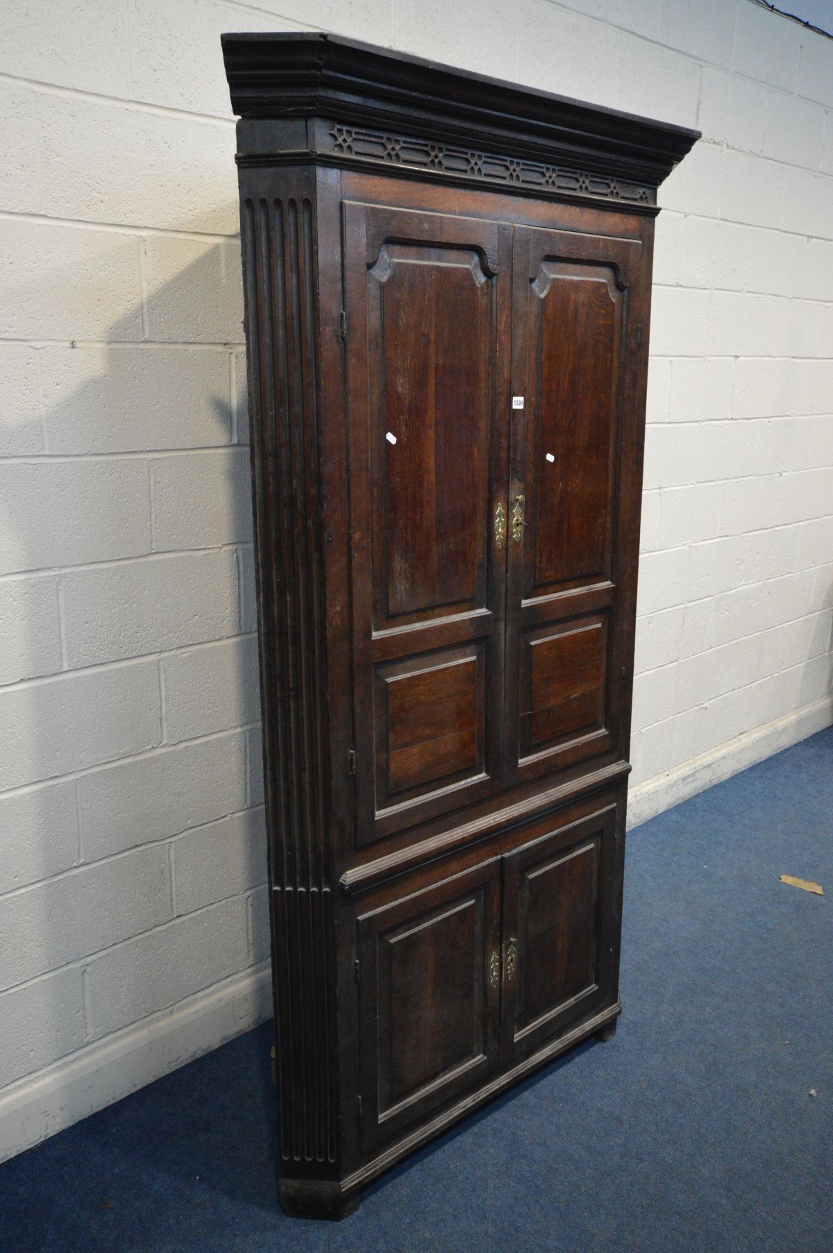 A LARGE OAK GEORGIAN FREESTANDING CORNER CUPBOARD, fixed cornice above double fielded panels doors - Image 2 of 3