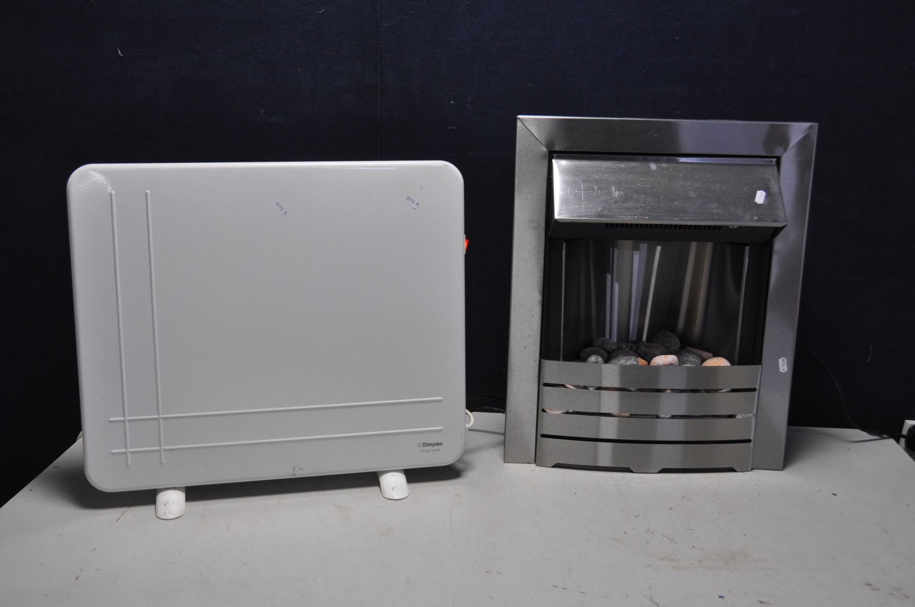 A STAINLESS STEEL FIRE EFFECT HEATER and a Dimplex panel radiator (both PAT pass and working) (2)
