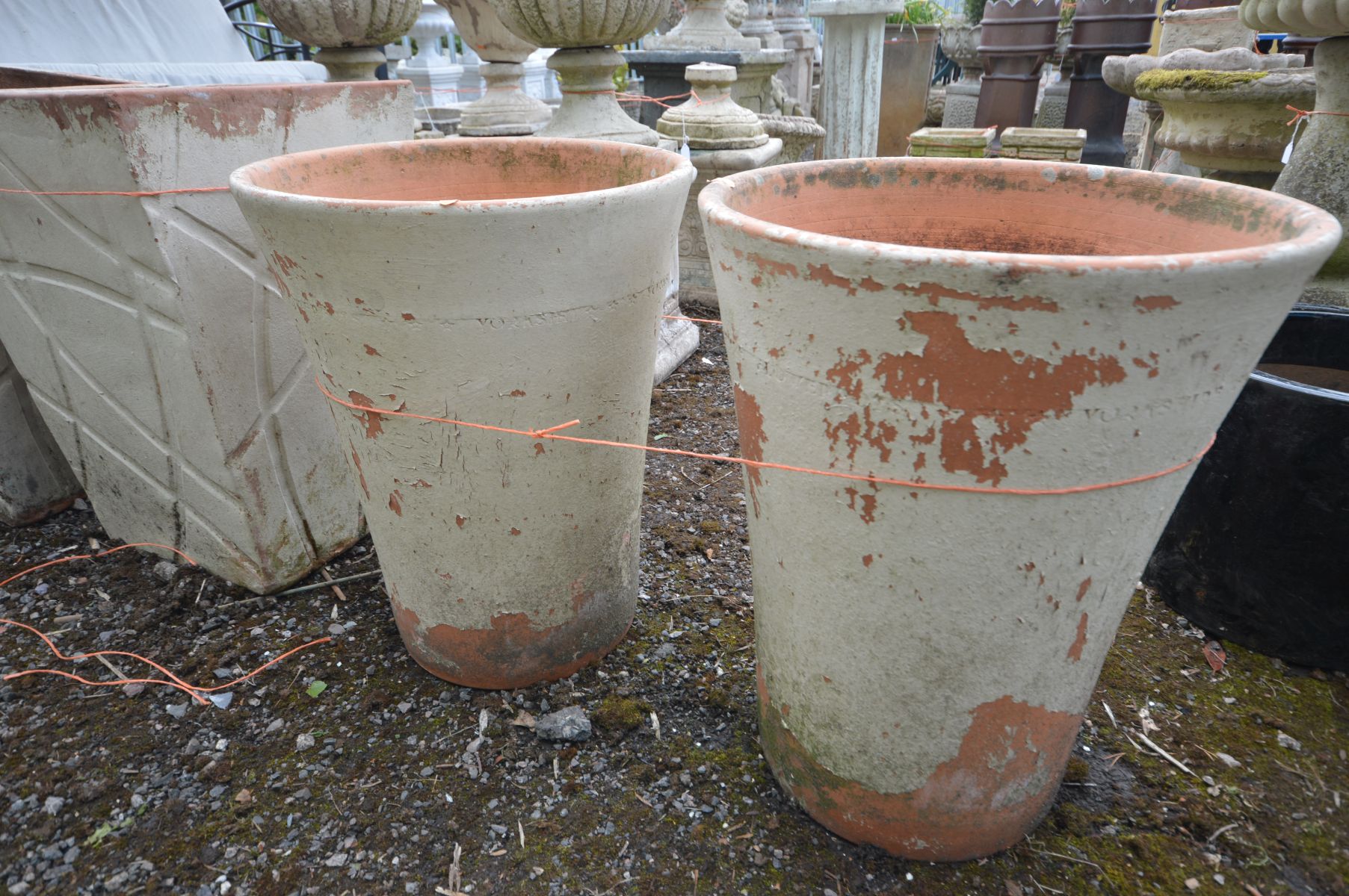 A PAIR OF TAPERED CYLINDRICAL TERRACOTTA PLANTERS, stamped to side 'Yorkshire flowerpots', outer