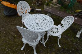 AN ALUMINIUM CIRCULAR GARDEN TABLE, diameter 67cm x height 65cm and three chairs, all overpainted