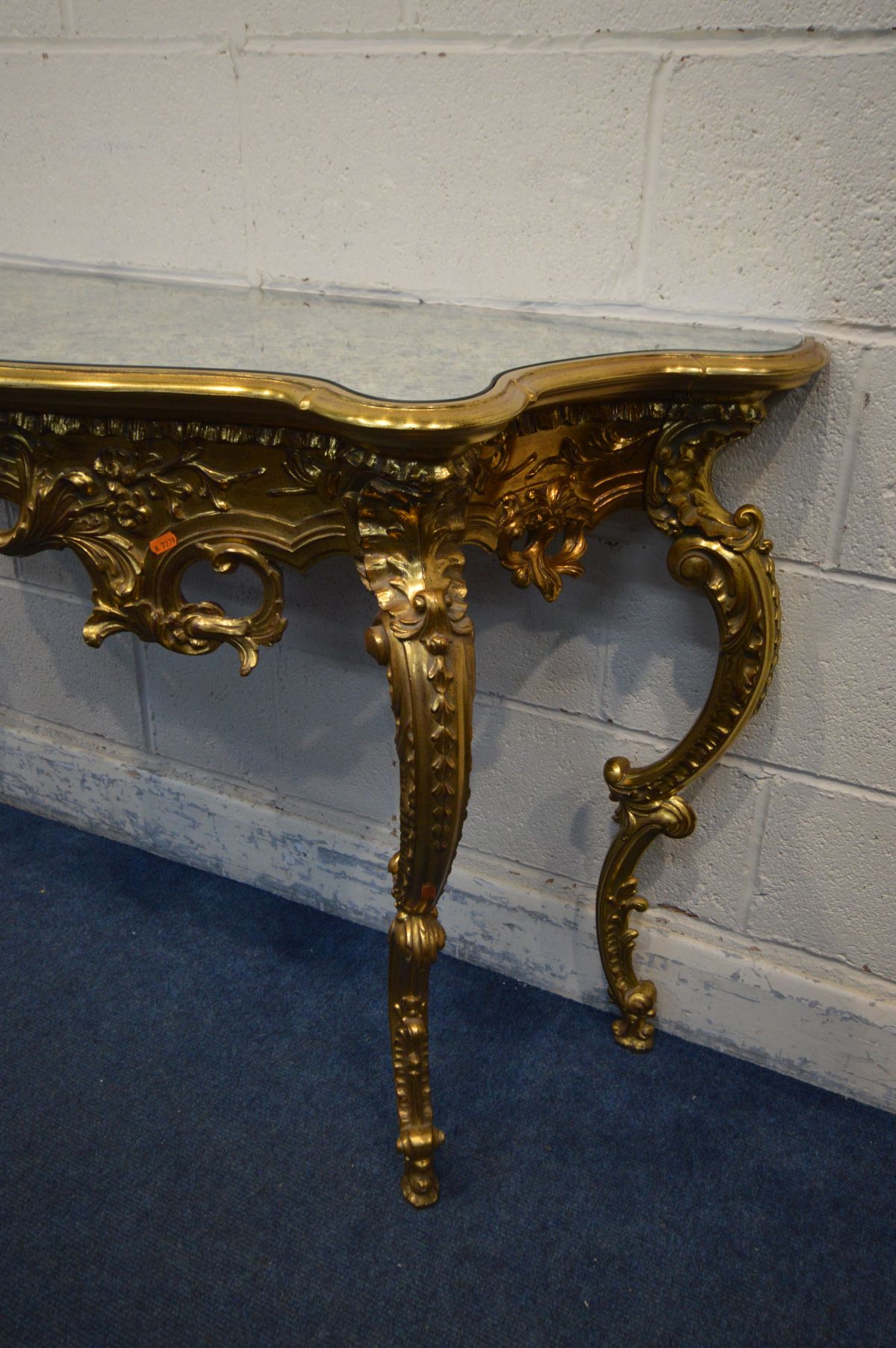 A LATE 20TH CENTURY GILTWOOD FRENCH STYLE HALL TABLE, with a decorated mirror top on four legs, - Image 4 of 4