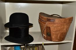 A LEATHER TOP HAT BOX (dent to side), containing a Tress & Co London top hat, 8 x 6¼ - signs of wear