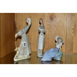 TWO LLADRO FIGURES OF GIRLS AND ANOTHER BY NAO, comprising no 4866 'Girl with Goose and Dog',