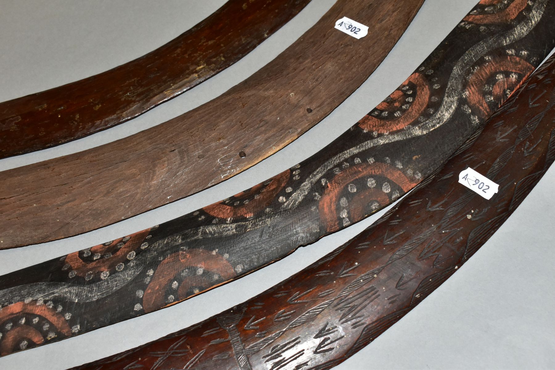 FOUR TRIBAL ART AUSTRALIAN ABORIGINAL BOOMERANGS, to include one carved to the side of arrows, - Image 7 of 9