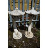 A PAIR OF COMPOSITE GARDEN JAPANESE PAGODA LANTERNS, on a curved support, height 82cm