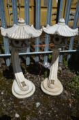 A PAIR OF COMPOSITE GARDEN JAPANESE PAGODA LANTERNS, on a curved support, height 82cm