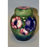 A MOORCROFT POTTERY GINGER JAR AND COVER, decorated in pink/blue anemone on a green ground,