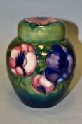 A MOORCROFT POTTERY GINGER JAR AND COVER, decorated in pink/blue anemone on a green ground,
