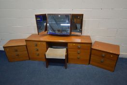 A STAG TEAK FOUR PIECE BEDROOM SUITE comprising a dressing table with a triple mirror, width 163cm x