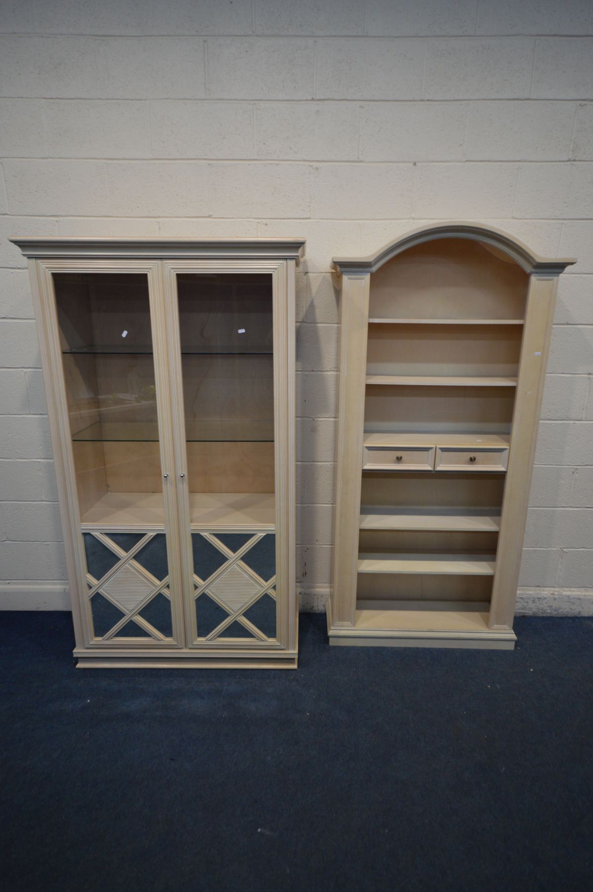 A BLEACHED WOOD TWO DOOR DISPLAY CABINET, with two glass shelves, width 107cm x depth 49cm x