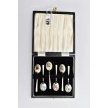 A CASED SET OF SIX ELIZABETH II SILVER AND ENAMEL COFFEE SPOONS, the cream enamel decorated with