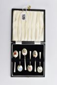 A CASED SET OF SIX ELIZABETH II SILVER AND ENAMEL COFFEE SPOONS, the cream enamel decorated with