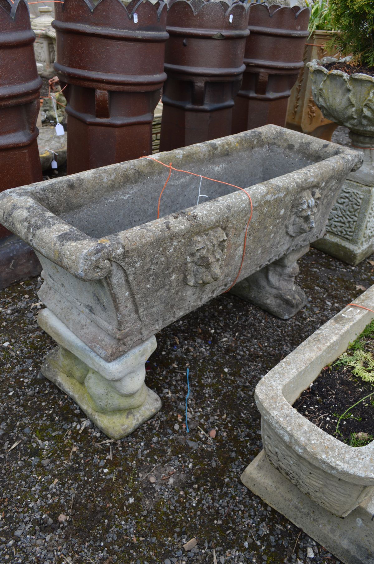 A COMPOSITE RECTANGULAR PLANTER with scrolled ends, on matched twin supports, width 98cm x depth - Image 2 of 2