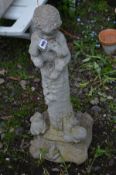 A COMPOSITE GARDEN STATUE OF A FAUN PLAYING PAN PIPES, with two squirrels and poem to the base,