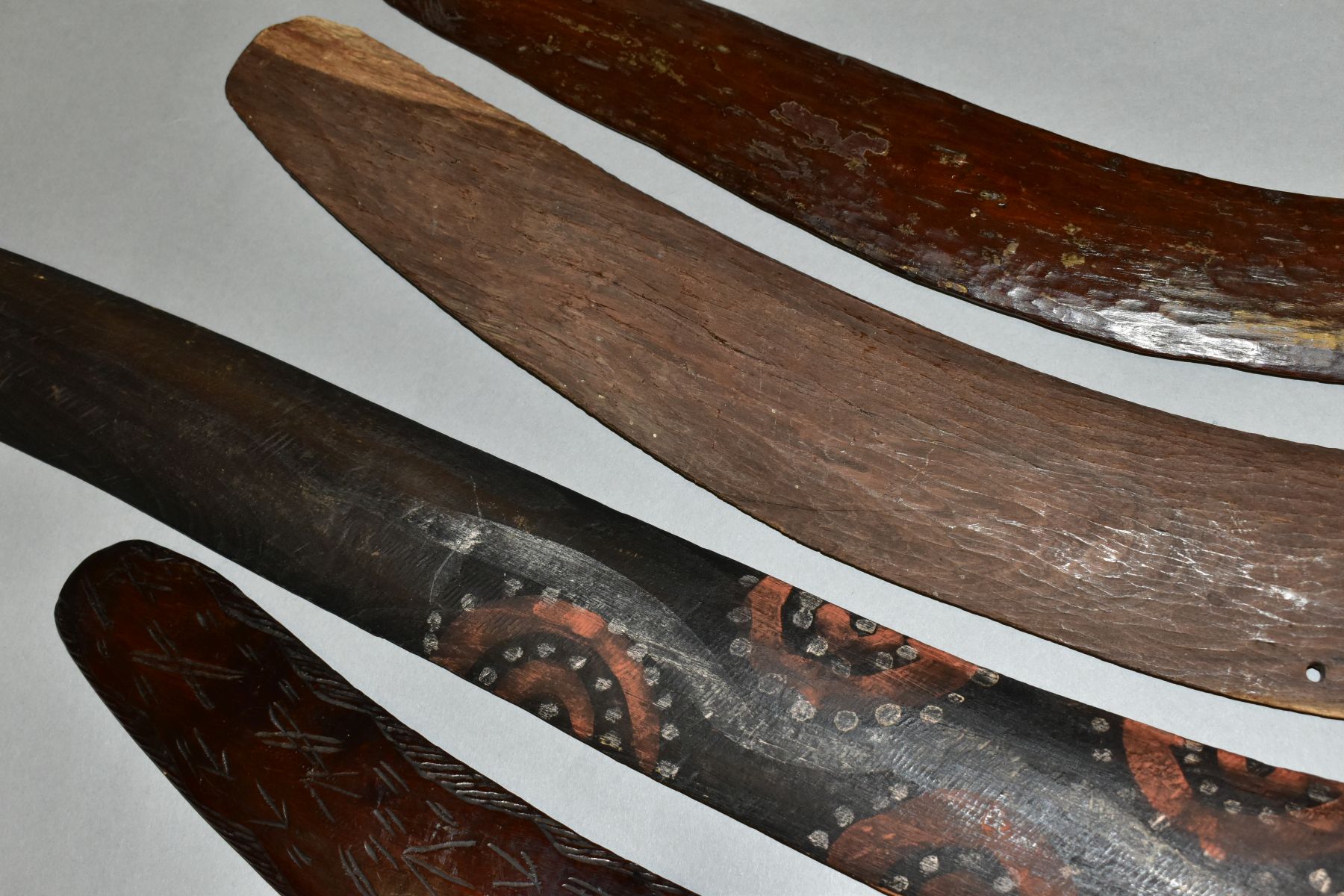 FOUR TRIBAL ART AUSTRALIAN ABORIGINAL BOOMERANGS, to include one carved to the side of arrows, - Image 9 of 9