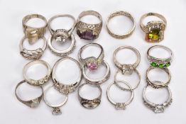 A BAG OF ASSORTED RINGS, twenty white metal rings to include a silver ring designed with a central