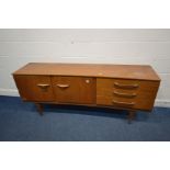 A TEAK 6FT CONCAVE SIDEBOARD, a bank of three drawers, the top drawer with a green baize lined