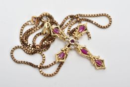 A 9CT GOLD RUBY AND DIAMOND PENDANT AND CHAIN, the cross pendant set with five marquise shape rubies