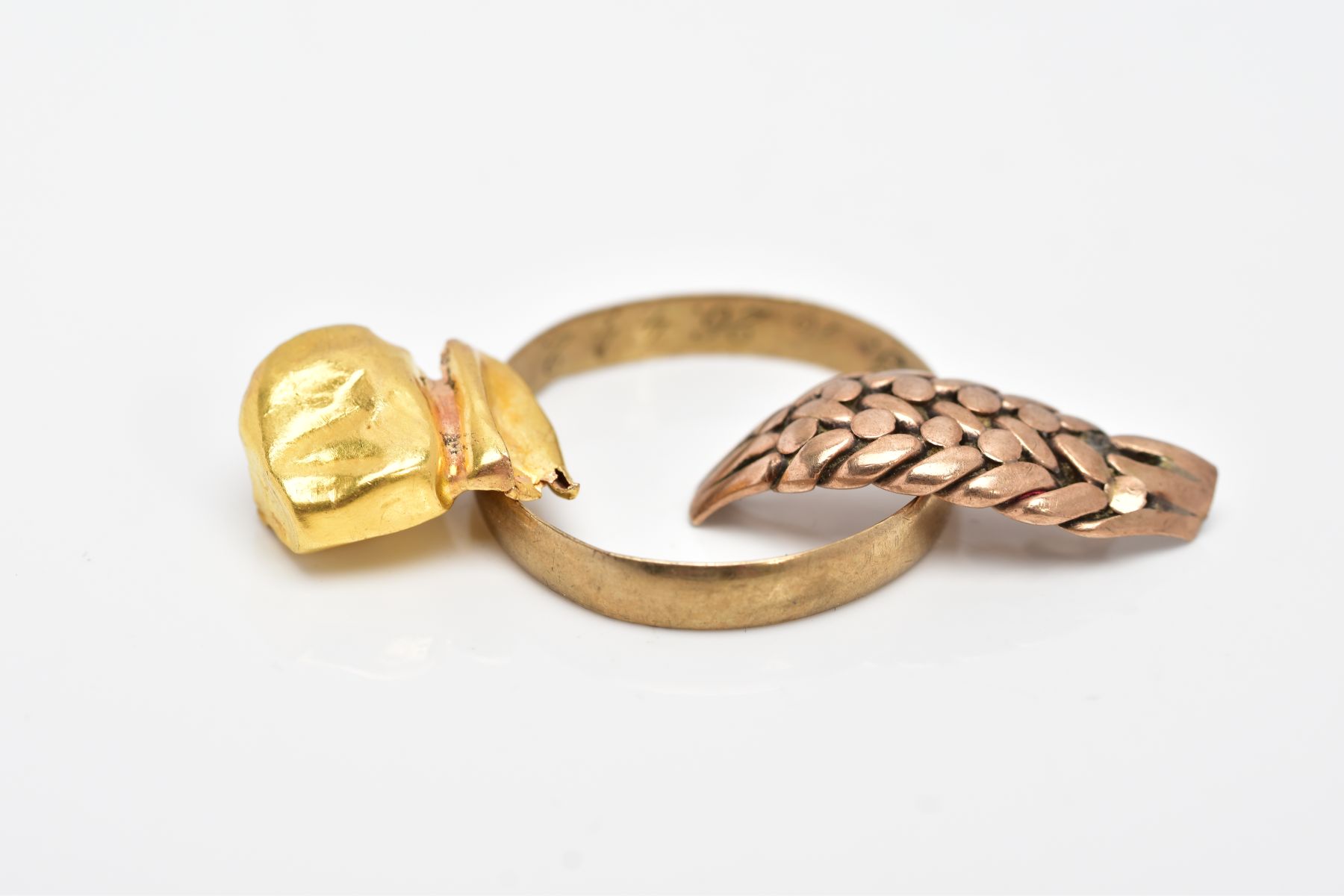 A YELLOW METAL RING, ROSE GOLD HEAD OF A RING AND A GOLD TONE TOOTH CAP, the plain polished - Image 3 of 3