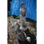 A COMPOSITE GARDEN FIGURE OF A LADY IN ROBES, holding a bird, height 80cm and another figure of a