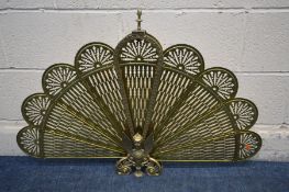 A BRASS FAN FIRESCREEN, with a mythical figure to centre