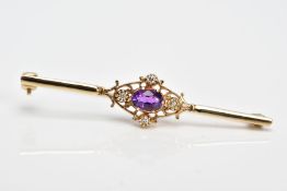 A LATE 20TH CENTURY 9CT GOLD AMETHYST AND DIAMOND BROOCH, designed with a claw set, oval cut