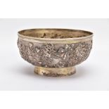 A LATE 19TH/EARLY 20TH CENTURY SHANGHAI SILVER BOWL, embossed floral design on a slightly raised