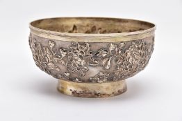 A LATE 19TH/EARLY 20TH CENTURY SHANGHAI SILVER BOWL, embossed floral design on a slightly raised