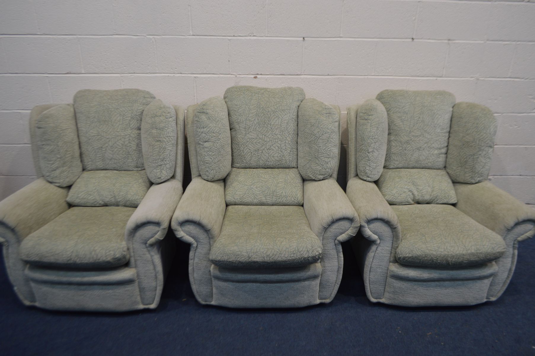 THREE GREEN UPHOLSTERED ARMCHAIRS