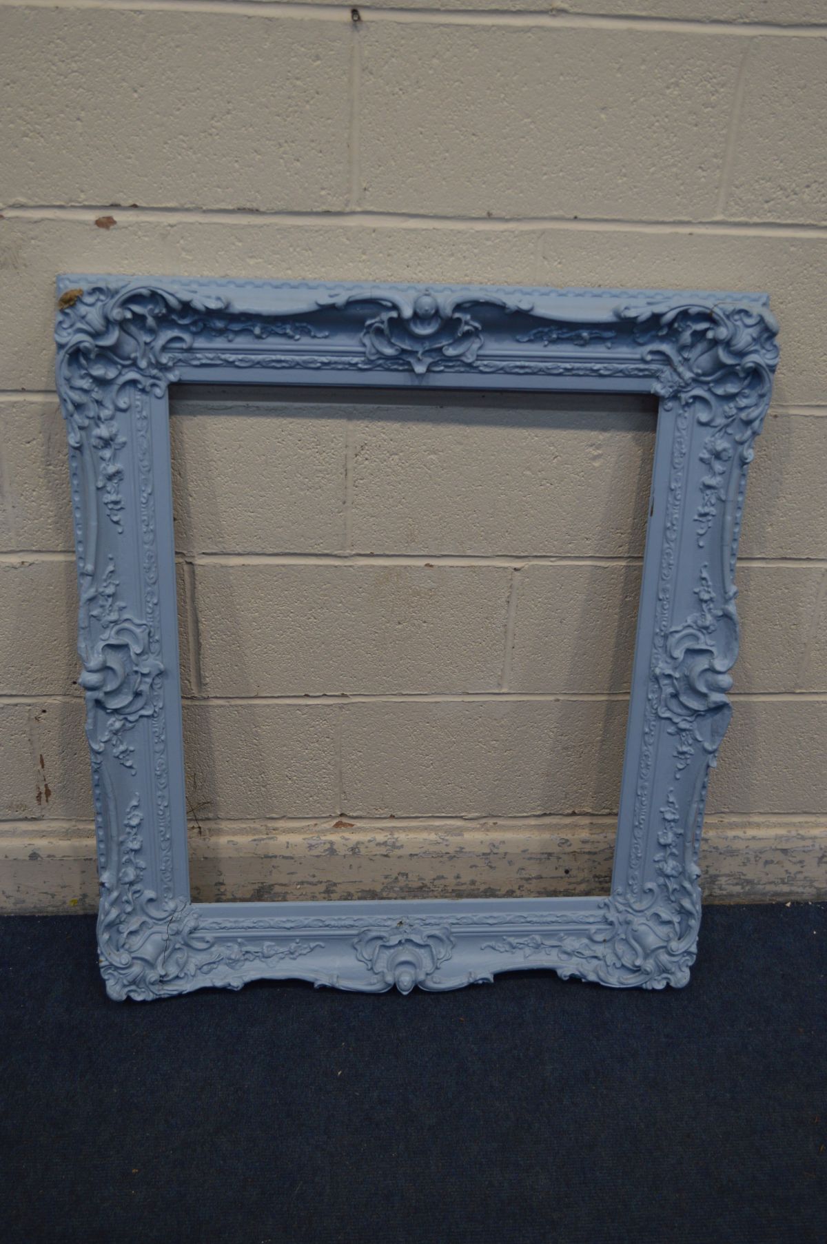 A ROCOCO PICTURE FRAME, later painted blue, 100cm x 87cm (SD)