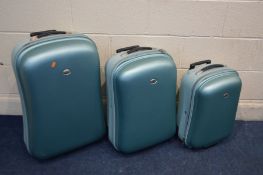 A SET OF THREE MINT GREEN GRADUATED SUITCASES