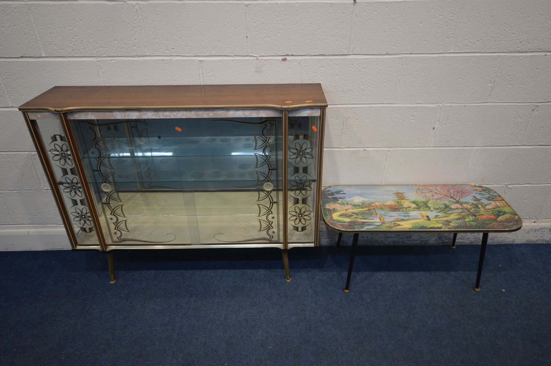 A MID 20TH CENTURY WALNUT FINISH CHINA CABINET, double sliding glass decorated doors enclosing a