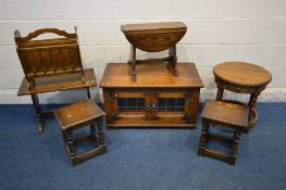 A COLLECTION OF REPRODUCTION OAK FURNITURE, to include a lead glazed tv cabinet, circular occasional