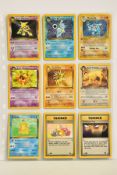 A QUANTITY OF POKEMON CARDS, just over 100 Pokemon TCG cards from Base Set, Base Set 2, Fossil,