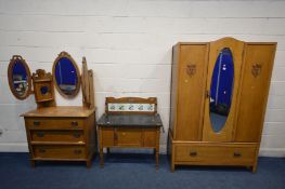 AN EARLY 20TH CENTURY MATCHED TWO PIECE BEDROOM SUITE comprising a single door wardrobe with a