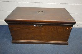 AN EARLY 20TH CENTURY OAK BLANKET CHEST, initialled 'AHH, 1904' to the lid, with twin brass handles,