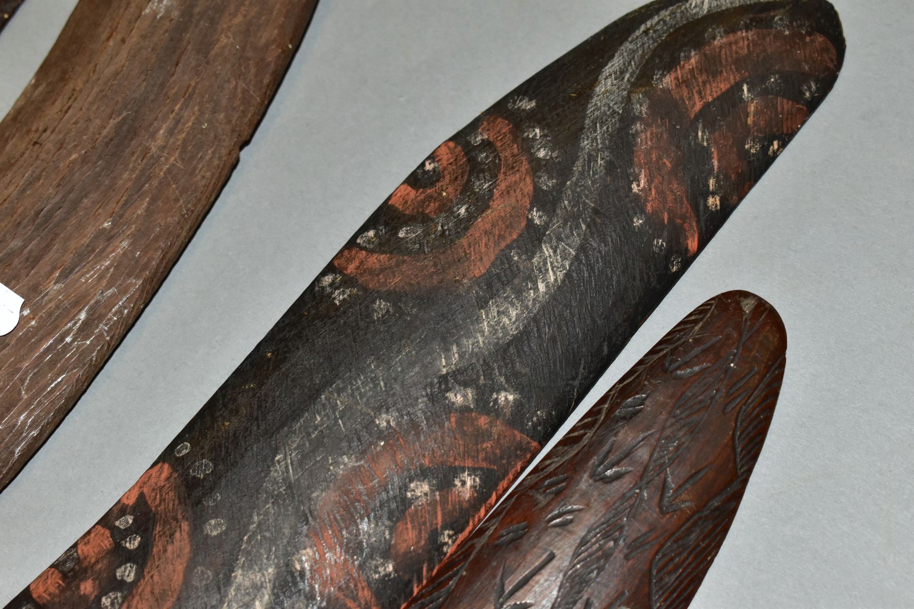 FOUR TRIBAL ART AUSTRALIAN ABORIGINAL BOOMERANGS, to include one carved to the side of arrows, - Image 8 of 9
