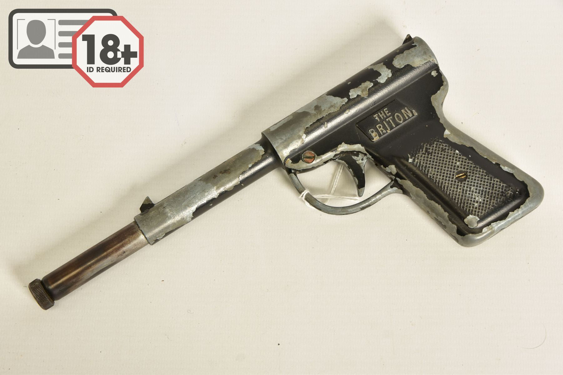 A .177'' GAT TYPE AIR PISTOL marked Briton, it's japanned surfaces have lost a considerable amount