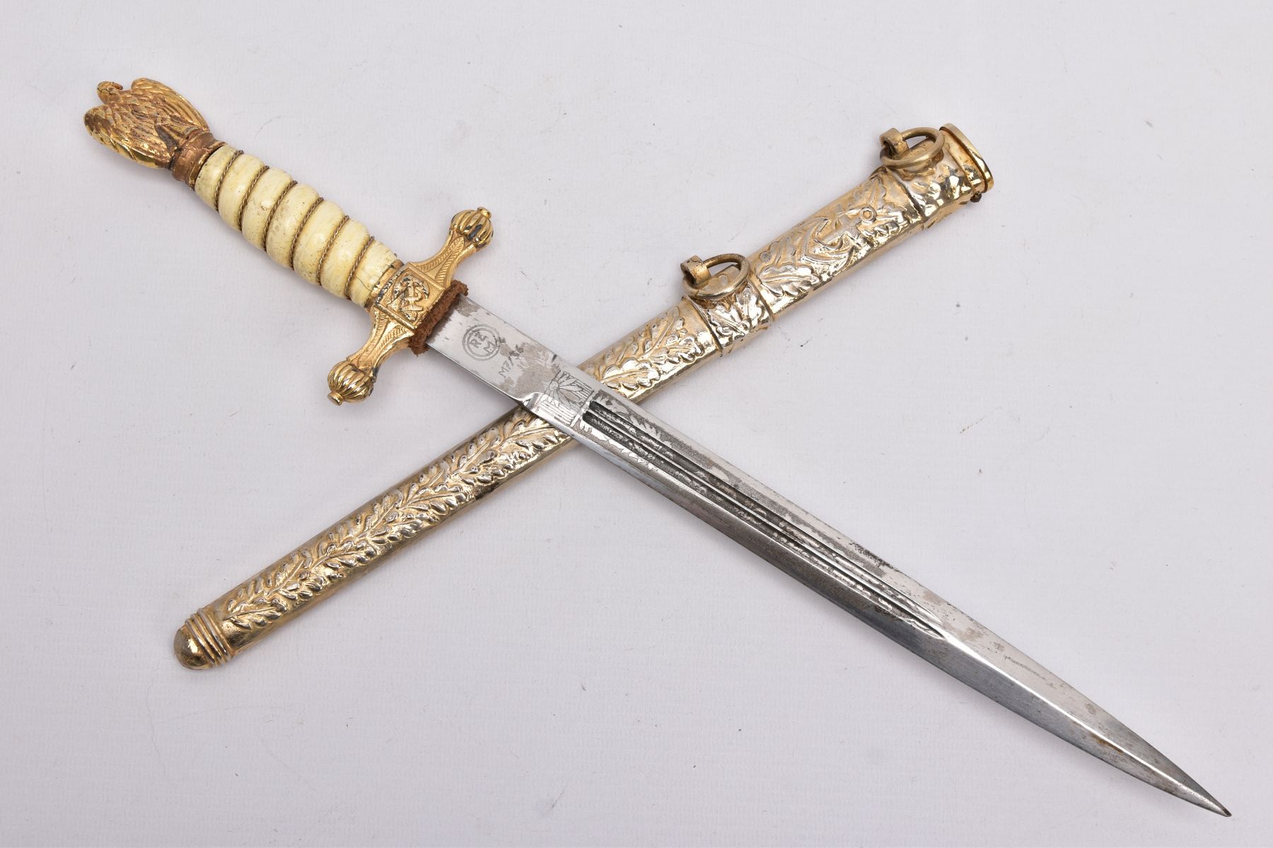 A POST WWII COPY OF A GERMAN KRIEGSMARINE OFFICERS DAGGER, blade has a circular RZM logo with M7/