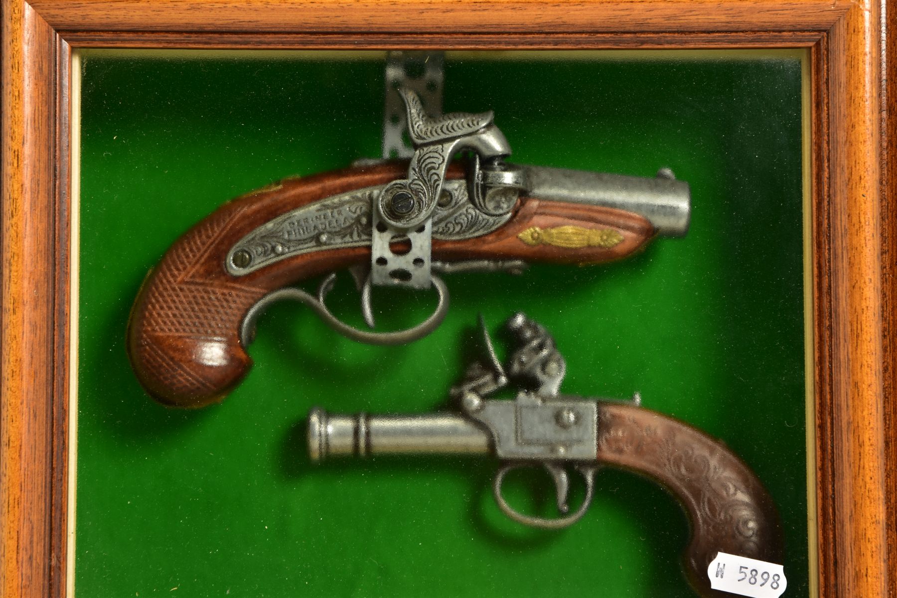 A NEATLY FRAMED DISPLAY CASE containing a white metal replica of a percussion American derringer and - Image 2 of 3