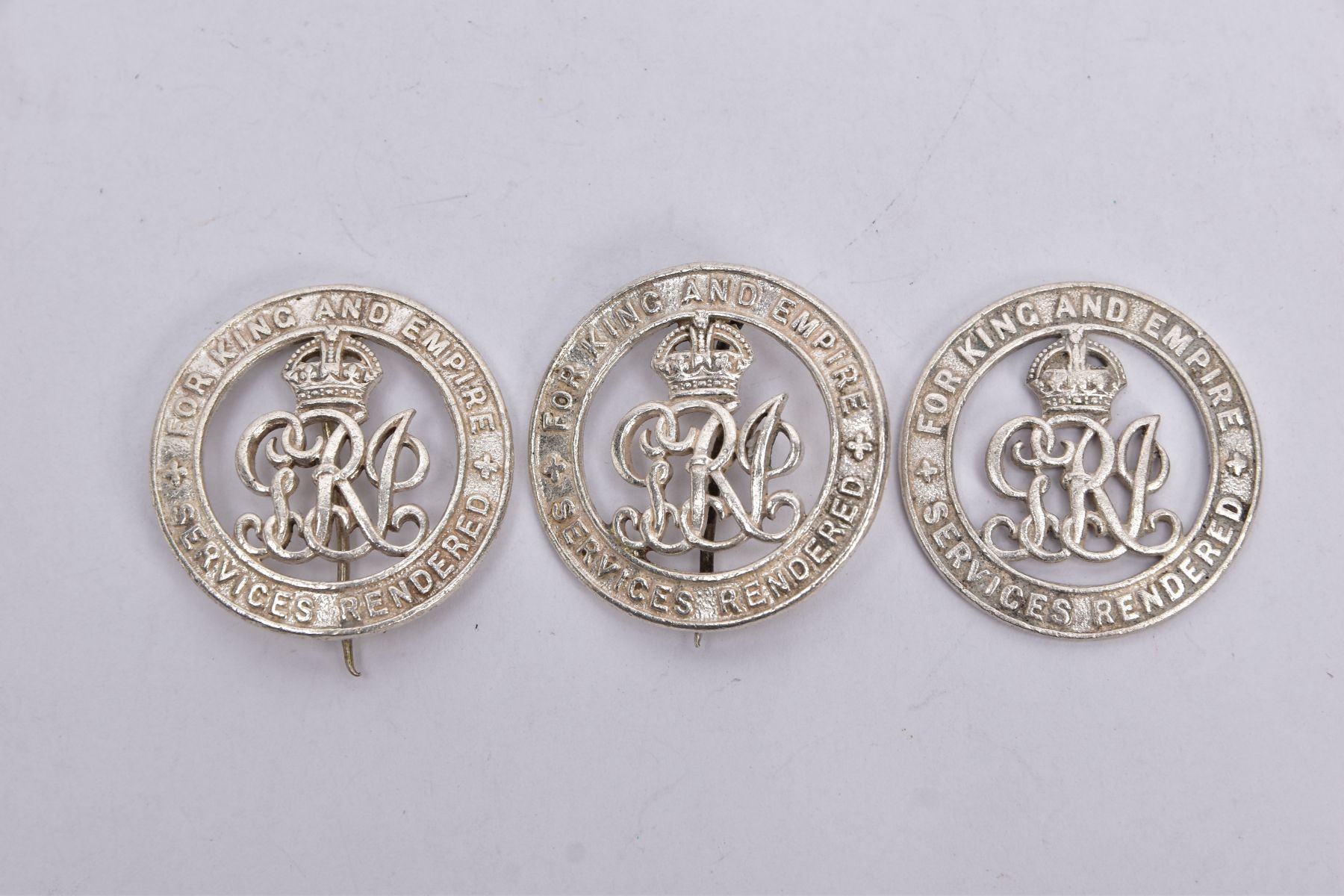 THREE 'FOR KING & EMPIRE SERVICES' RENDERED BADGES IN BRIGHT SILVER COLOUR, all three are