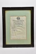 A FRAMED CERTIFICATE ON VELLUM measuring 34cm x 23cm, housed with a card border and in turn a period