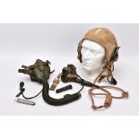 A WWII ERA USA FLYING HELMET IN BEIGE CANVAS WITH ATTACHED RADIO COMMUNICATION LEAD, the cap is by