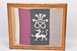 A GLAZED FRAME CONTAINING A REGIMENTAL PENNANT, approximately 50cm x 42cm, the pennant has three