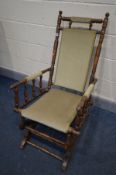 AN EDWARDIAN BEECH AMERICAN ROCKING CHAIR